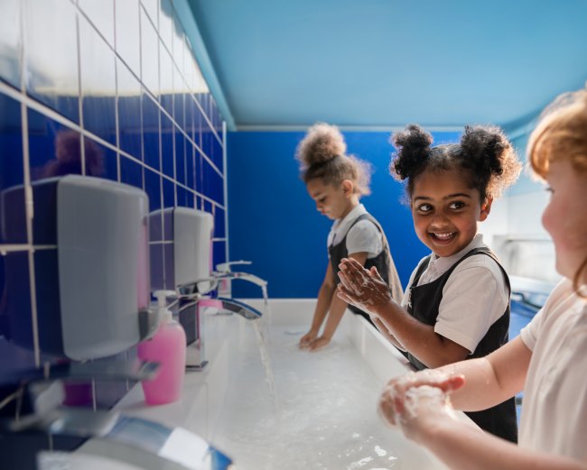 Girls washing their hands